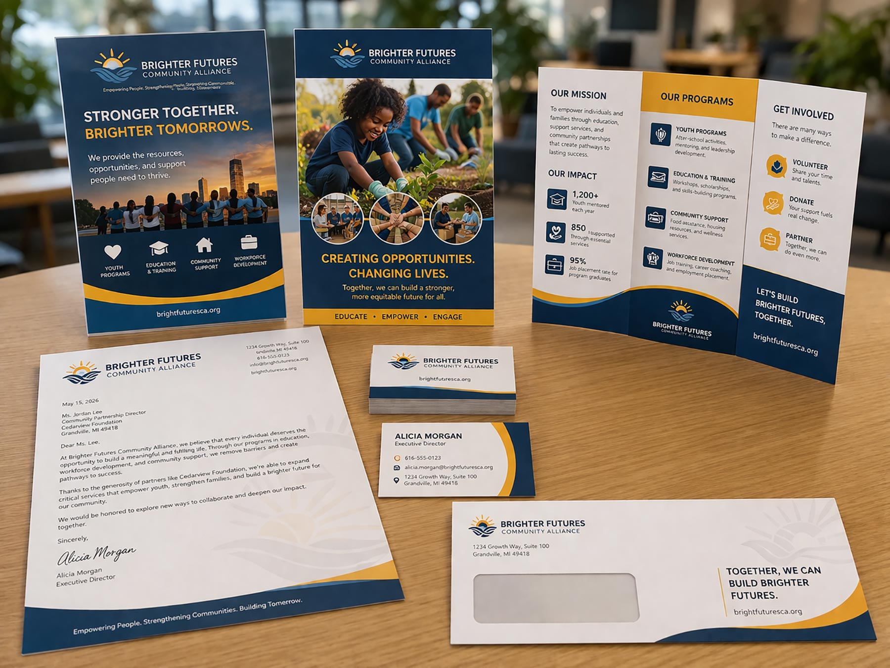 Letterhead, business card, and envelope on a wooden work table